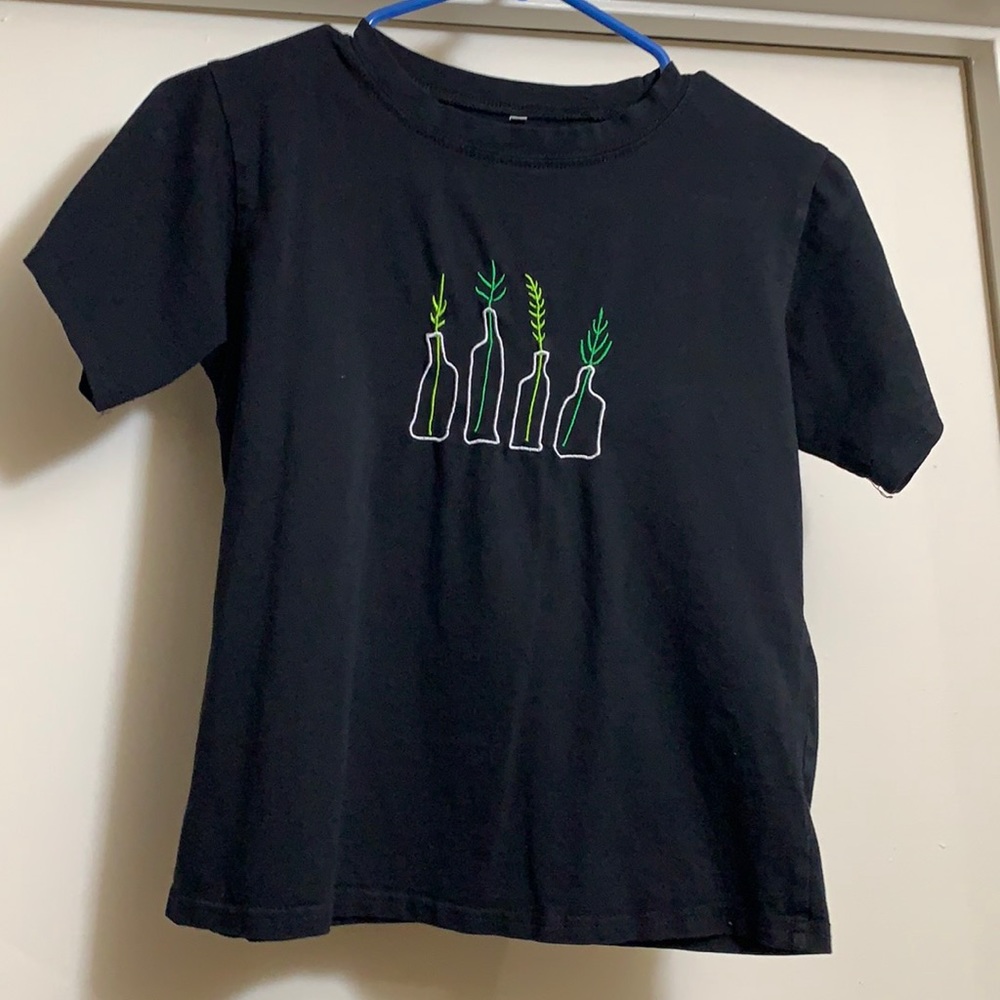 This top is somewhat fitted and is cropped but not too much